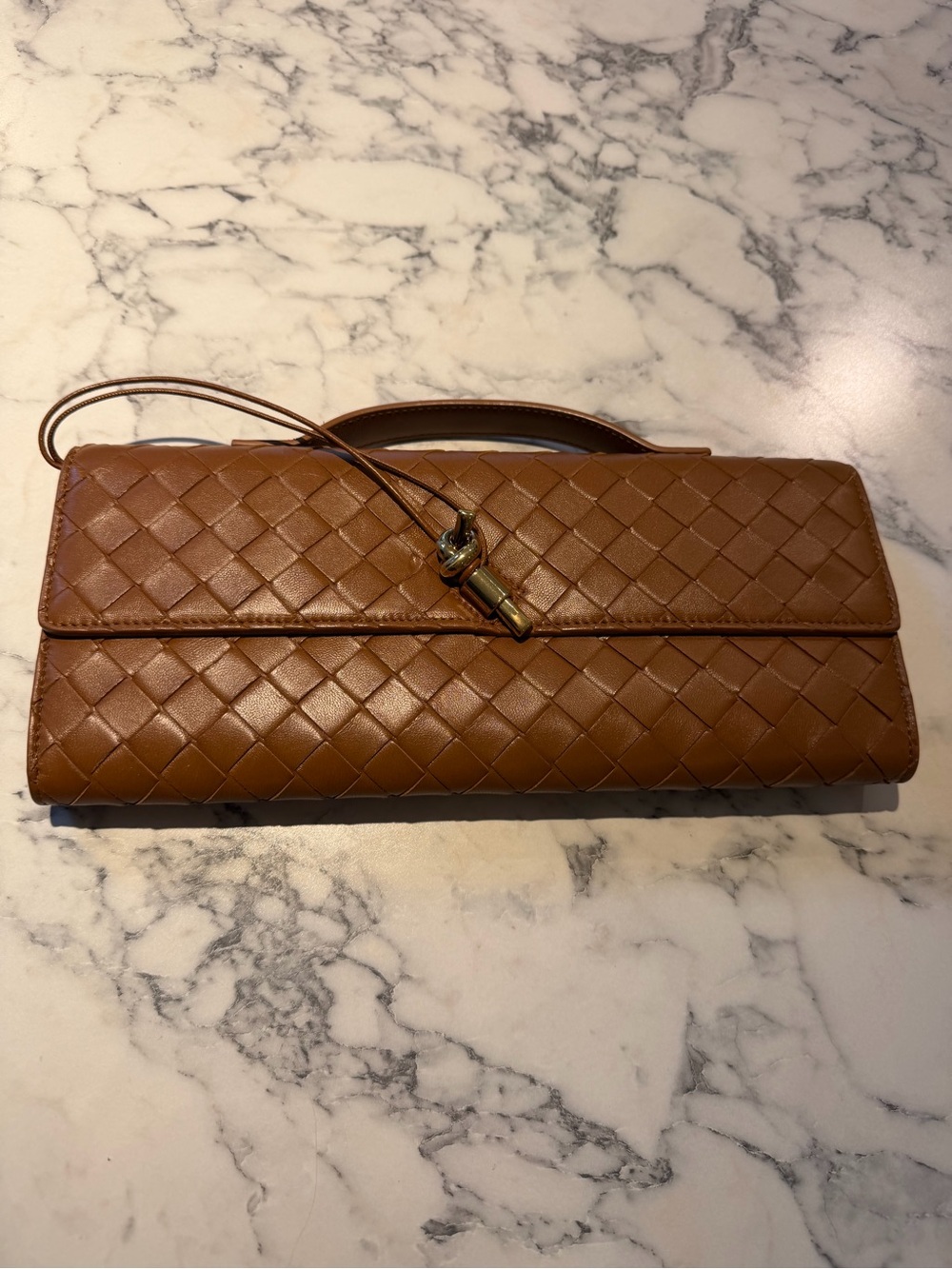 Bottega Veneta Cognac Intrecciato Leather Clutch with Tassel